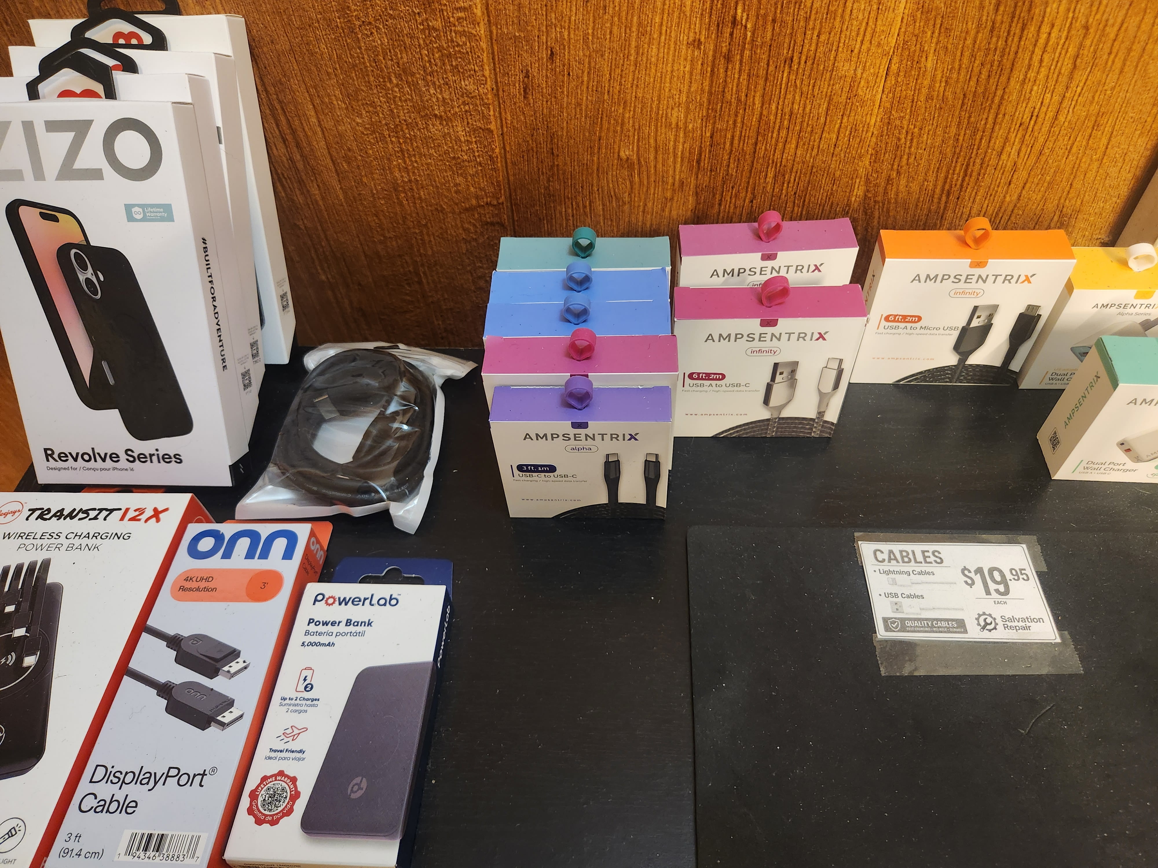 Accessory display wall with cables and cases