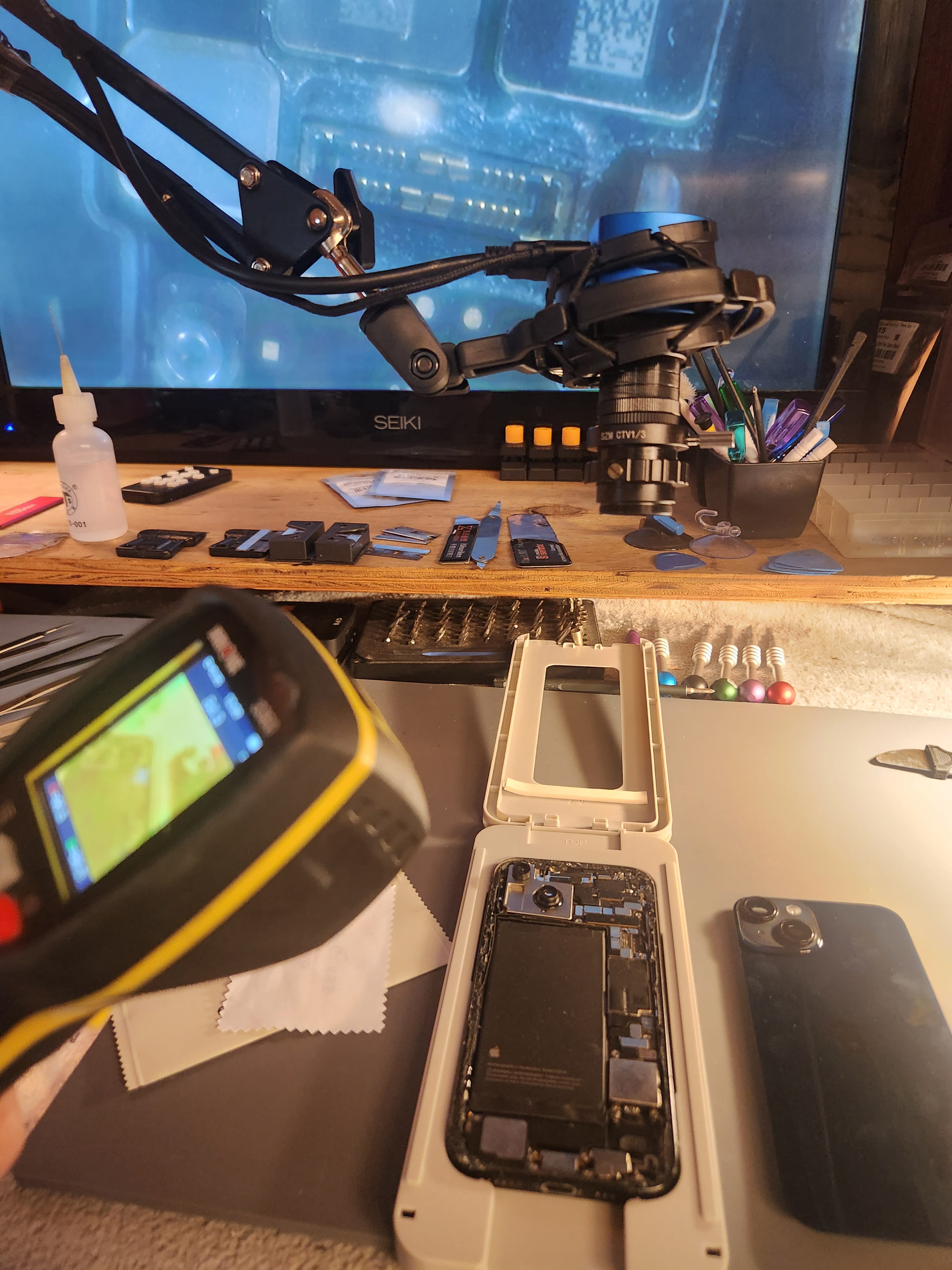 Close-up of a smartphone on a workbench